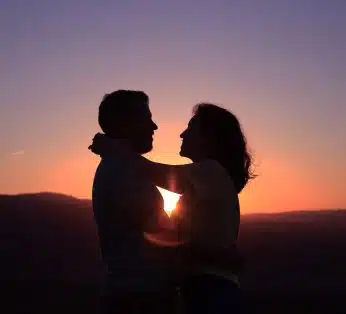 silhouette of hugging couple